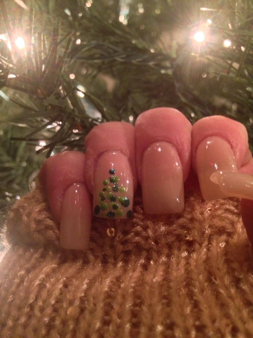 Now go throughout your nail and add small dots to finish your tree shape and to fill in empty areas.