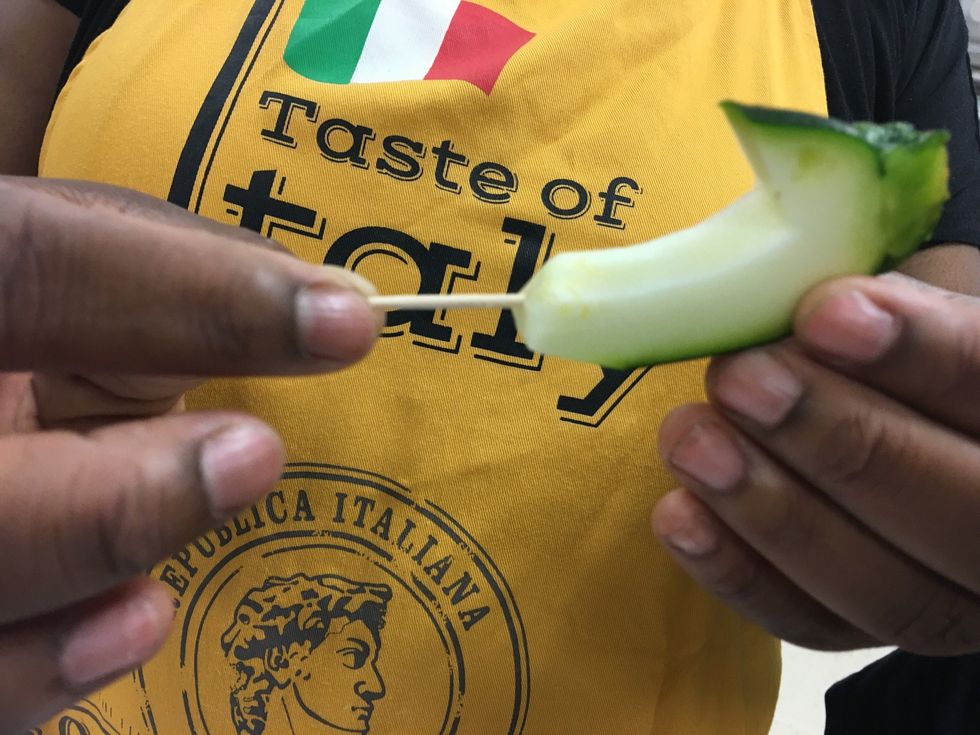 Now grab a toothpick and stick it directly in the bottom center of the head of the swan. And stick it half way in there.