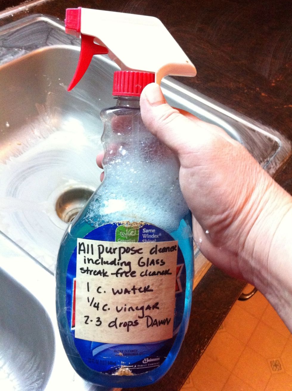 Now grab my Homemade All Purpose Cleaner. Mix up: 1 cup water, 1/4 cup vinegar, 2-3 drops Dawn dishwashing liquid. I like to add a drop of Blue food coloring. The blue coloring makes whites whiter.