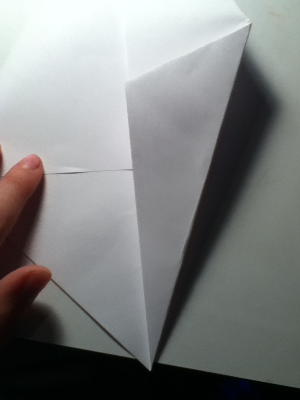 Now grab right point and fold up into the crease