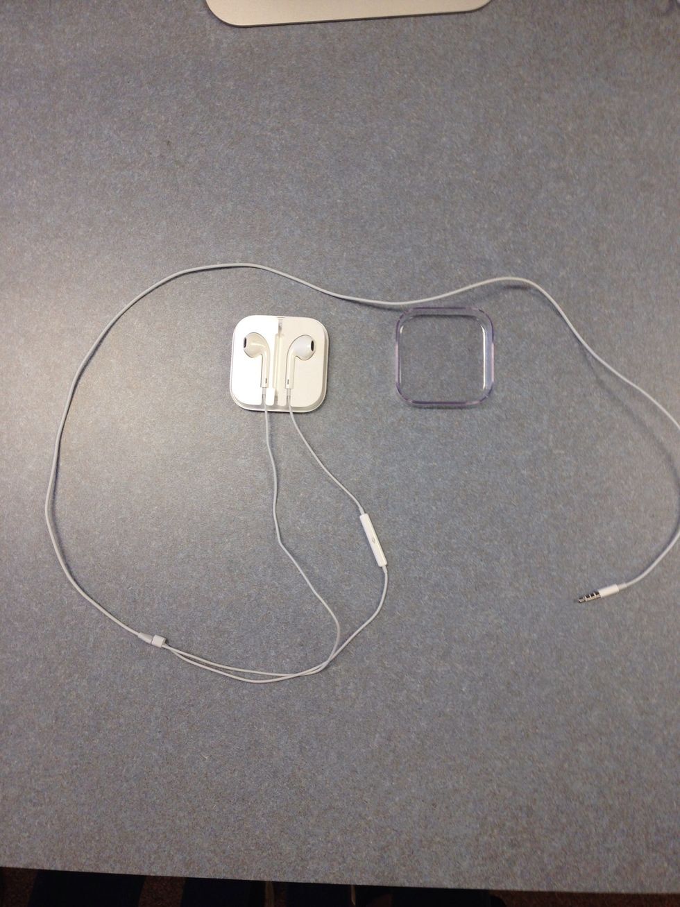 Now grab the other EarPod that has a letter "L" on it.  Place it in the left place holder as seen in the photo.  (You'll notice that each EarPod can only fit in the corresponding side for it to work.)