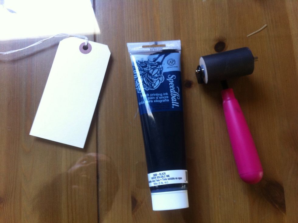 now grab your black ink and roller. easily stolen from the clowns that work at the local art store.