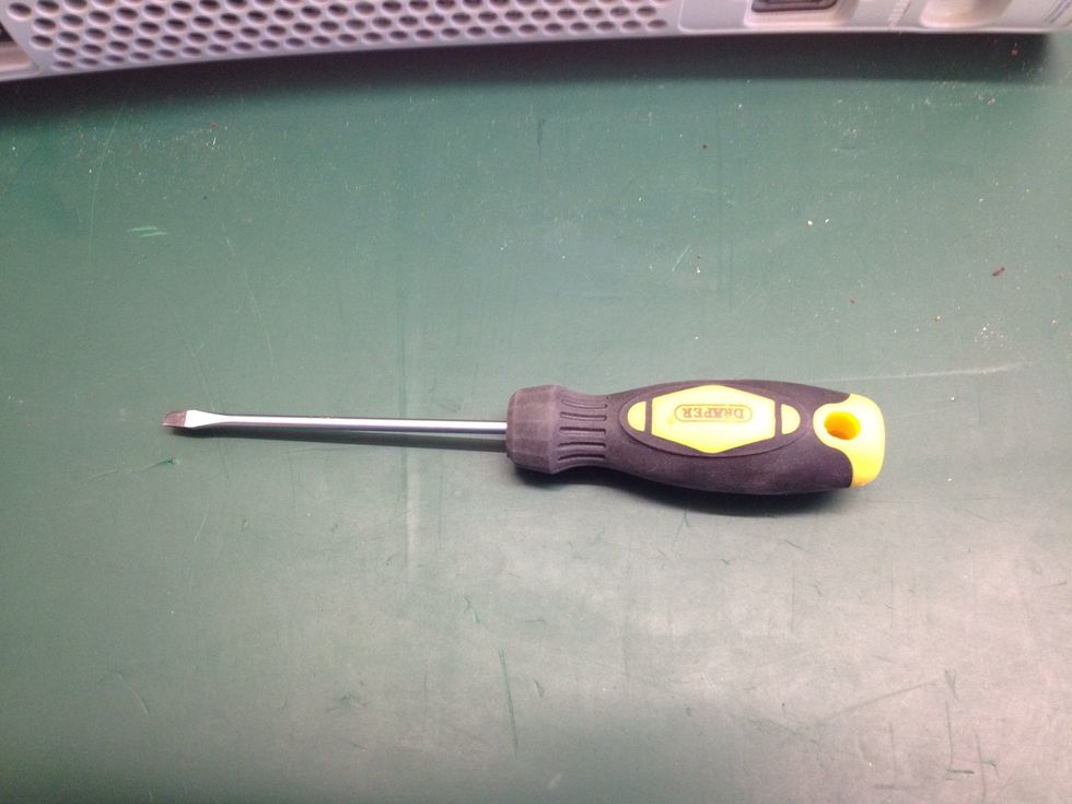 Now grab your small, flat-head screwdriver.