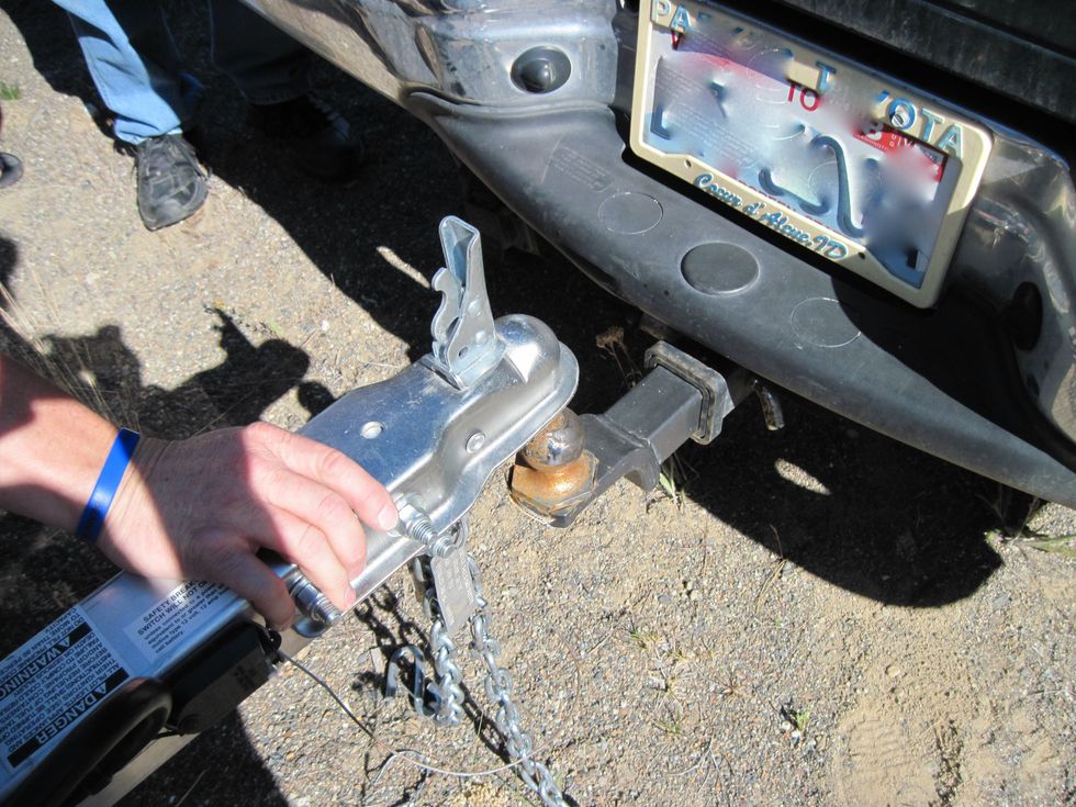 Now, having magically backed your tow vehicle up to within an inch of the hitch, wiggle and jiggle the hitch onto the ball.