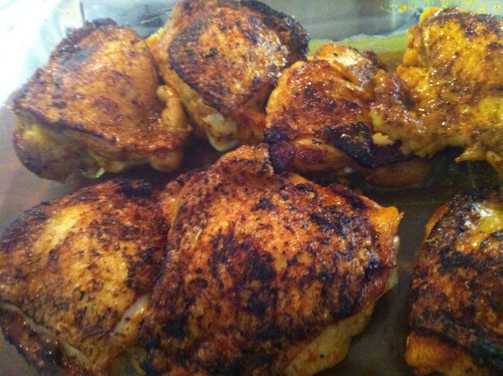 Now heat a wok or pot. Add oil and fry the chicken skin side down till its crispy. You do not need to cook it through at this stage. Remove and place it on a baking dish - skin side up