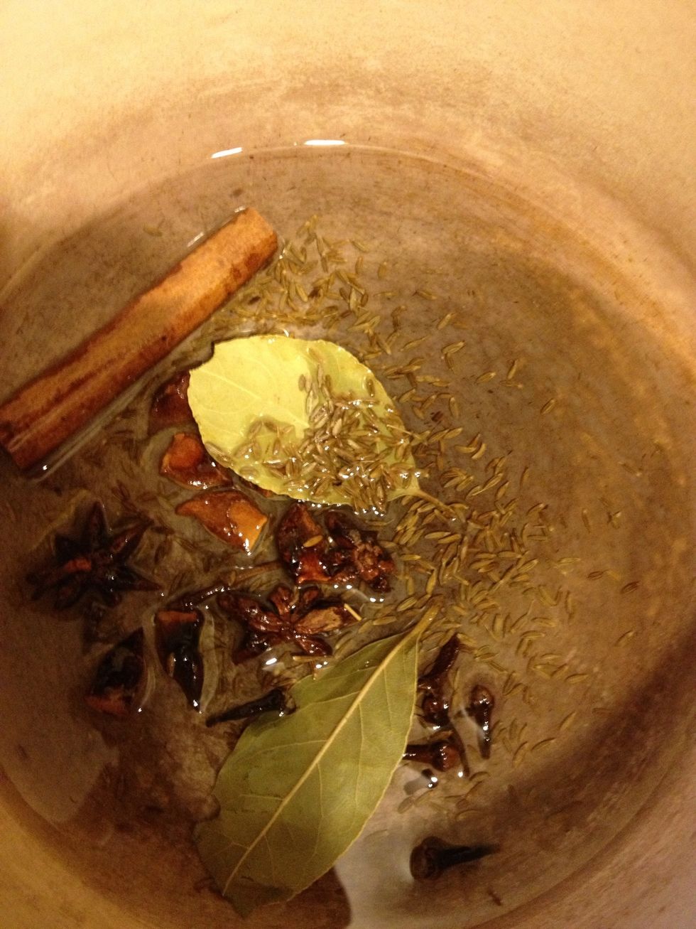 Now heat your pot and add bay leaves, cloves, cinnamon stick, star anise, and cumin