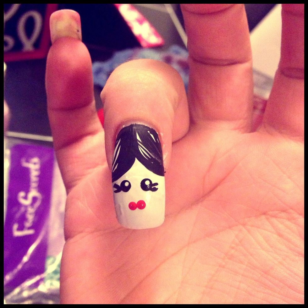 Now her lips.   Add two small red dots