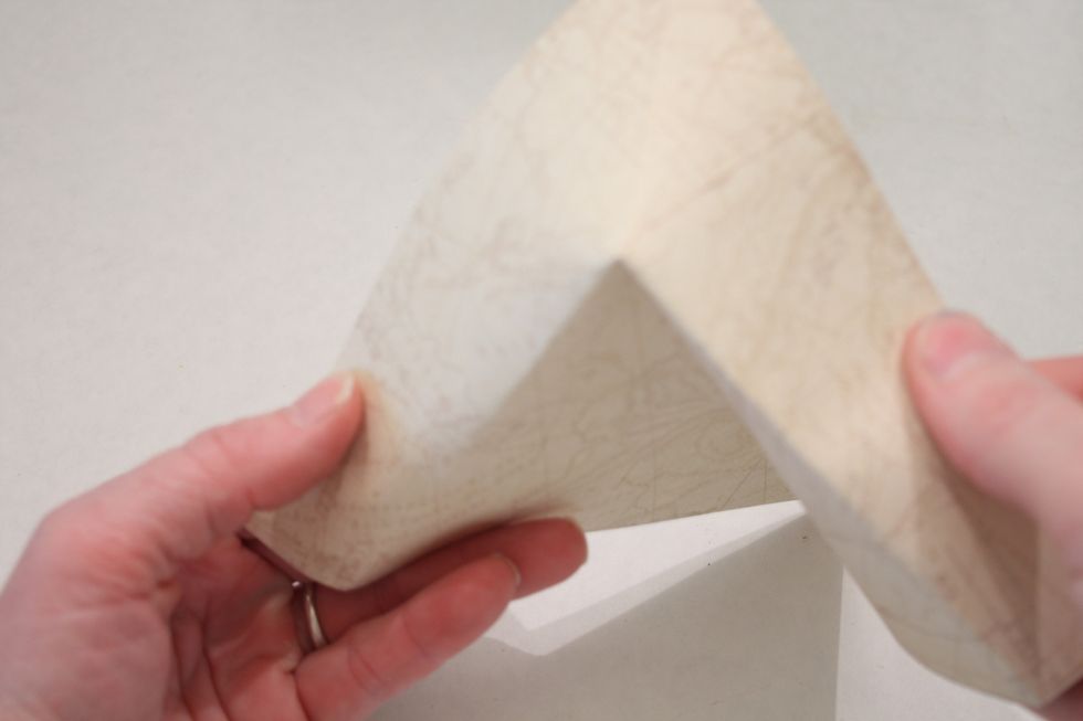Now- here is the tricky part- fold the crease backwards away from you