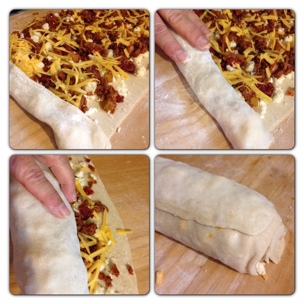 Now here's the fun part - we're going to roll this baby up! Easy...slow and easy. There, you got it! Wet the final edge to create a seal.