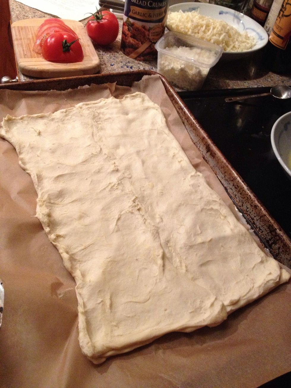 Now here's where I messed up a little. I thawed the pastry sheets for too long so the sheets wouldn't unfold. I decided to flatten both out and put everything on top of them. It worked!