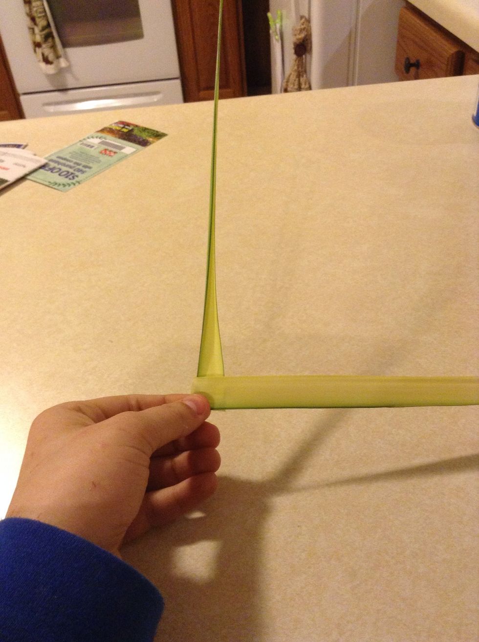 Now hold it by the middle and have the smaller tapering side pointing upwards and the bigger end pointing left.