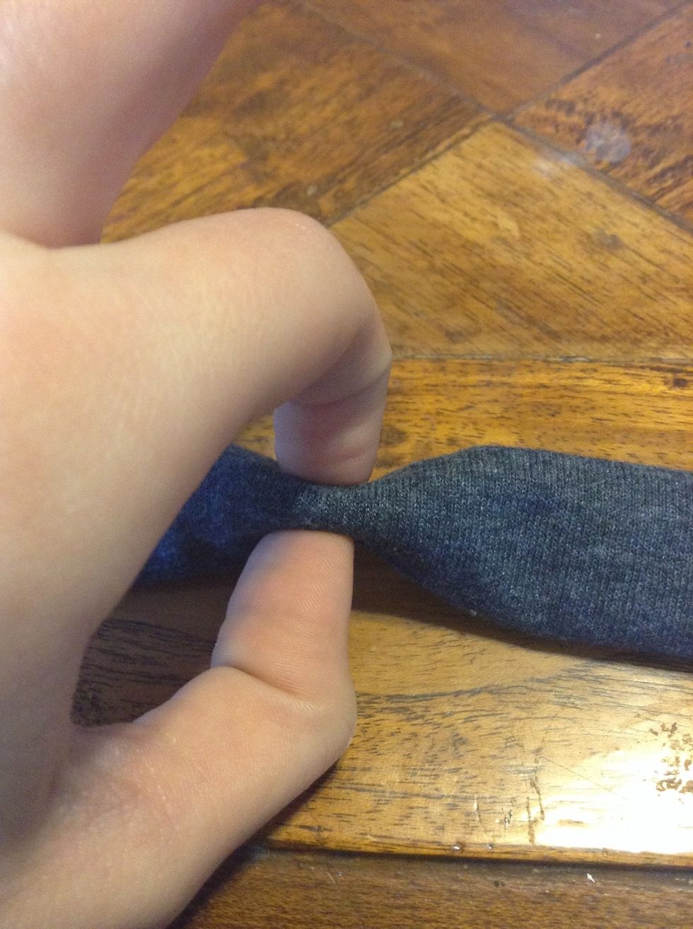 Now holding the center with your index finger and thumb