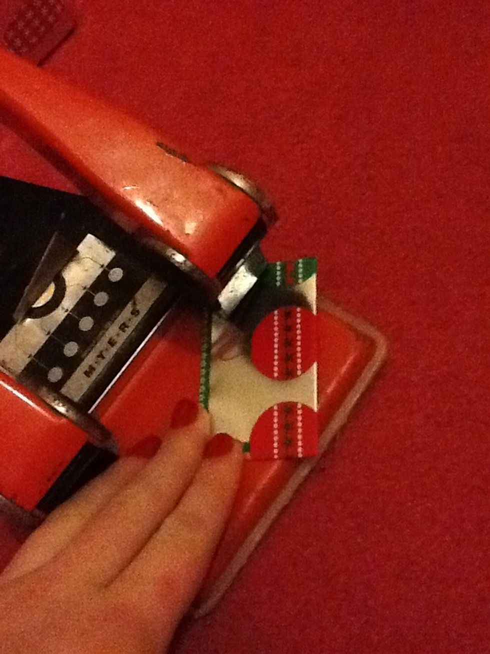 Now hole punch the top corner.