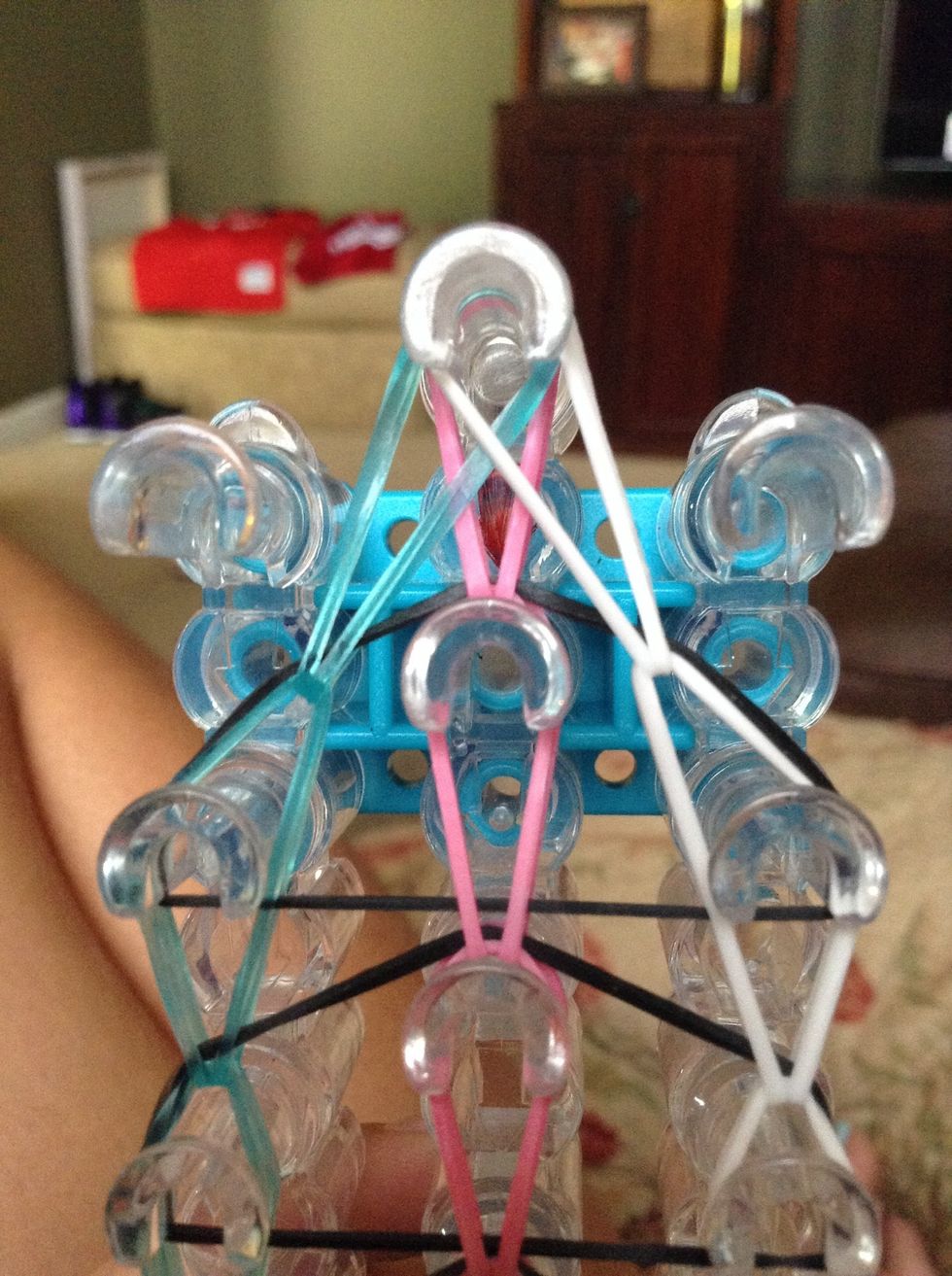 Now hook the right top rubber band to the middle.