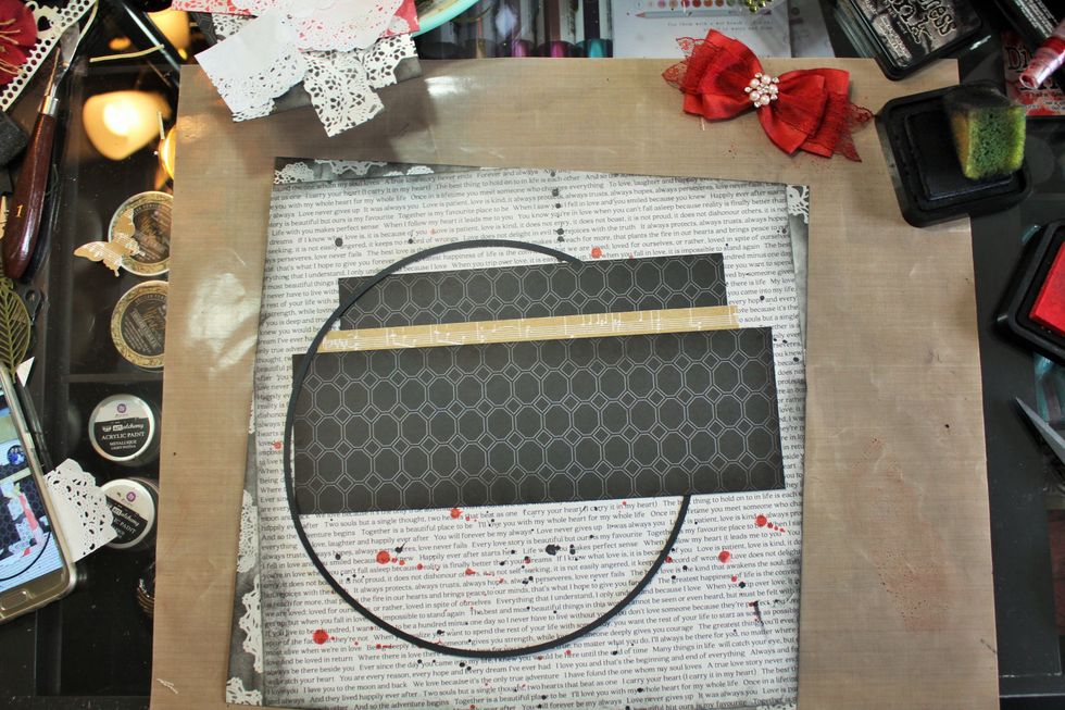 Now, I cut a ring using my Cricut and began layering the paper pieces.