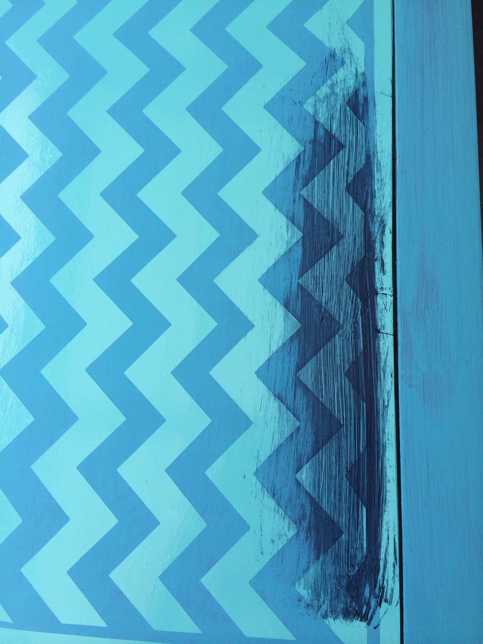 Now I decided to use a blue to contrast. I applied paint over entire middle area. I will remove vinyl after paint starts to dry a bit. I am only using vinyl as a stencil.