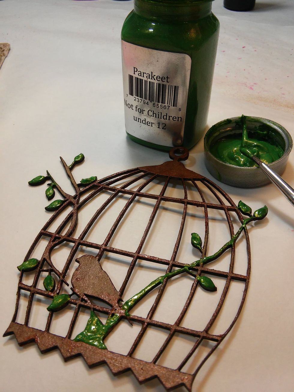 Now I'm adding some of that Parakeet Sorbet Paint to dab on the leaves and stems in my chipboard bird cage.
