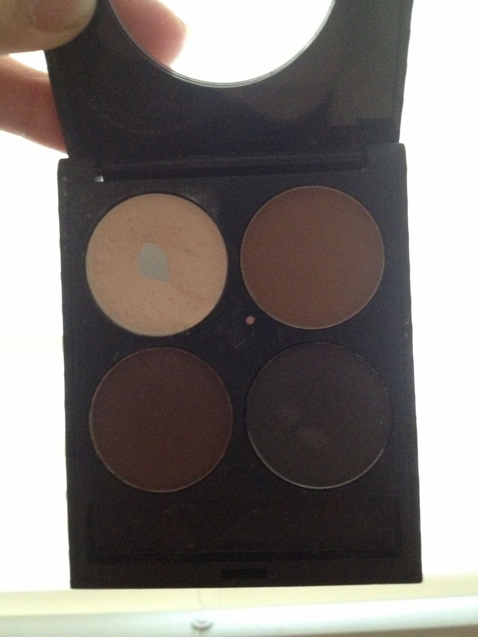 Now, I'm going to add a matte highlighter to my face, to give it some dimension. You can use any light eye shadow. I prefer matte, but shimmery highlighters look good too.