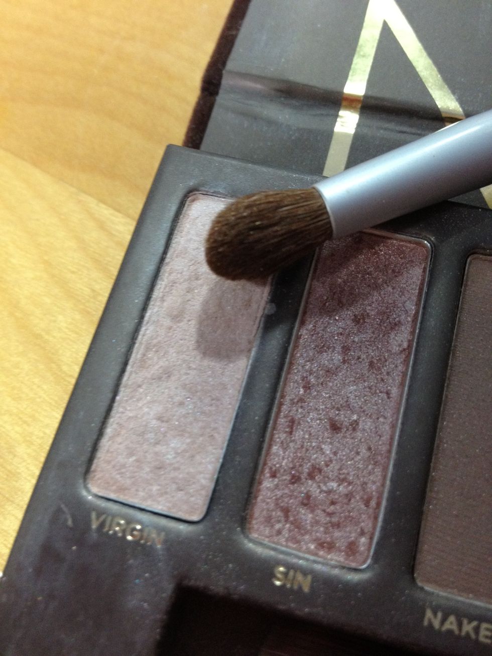 Now i'm going to take that same brush I just used and apply the color "Virgin" to highlight my brow