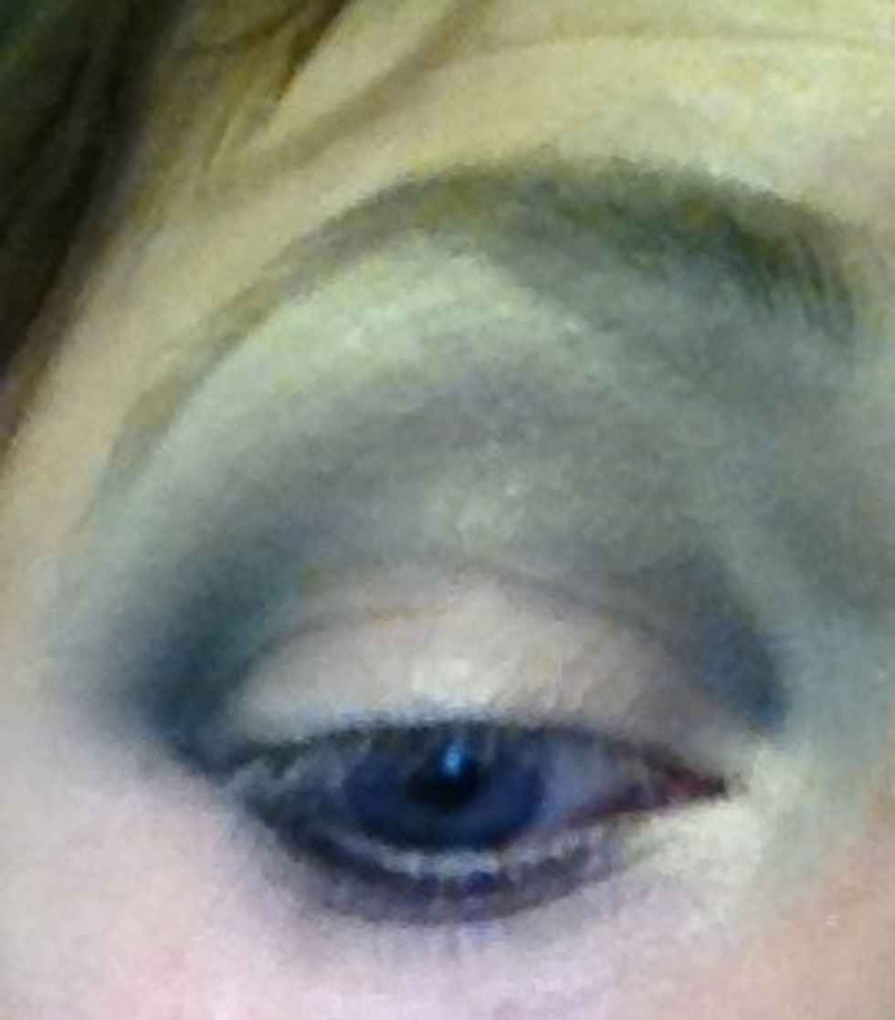 Now I'm starting to build colour into the outer corner and crease using a black shadow by Illamasqua with all you should build gradually and always blend with a blender brush to eliminate harsh lines