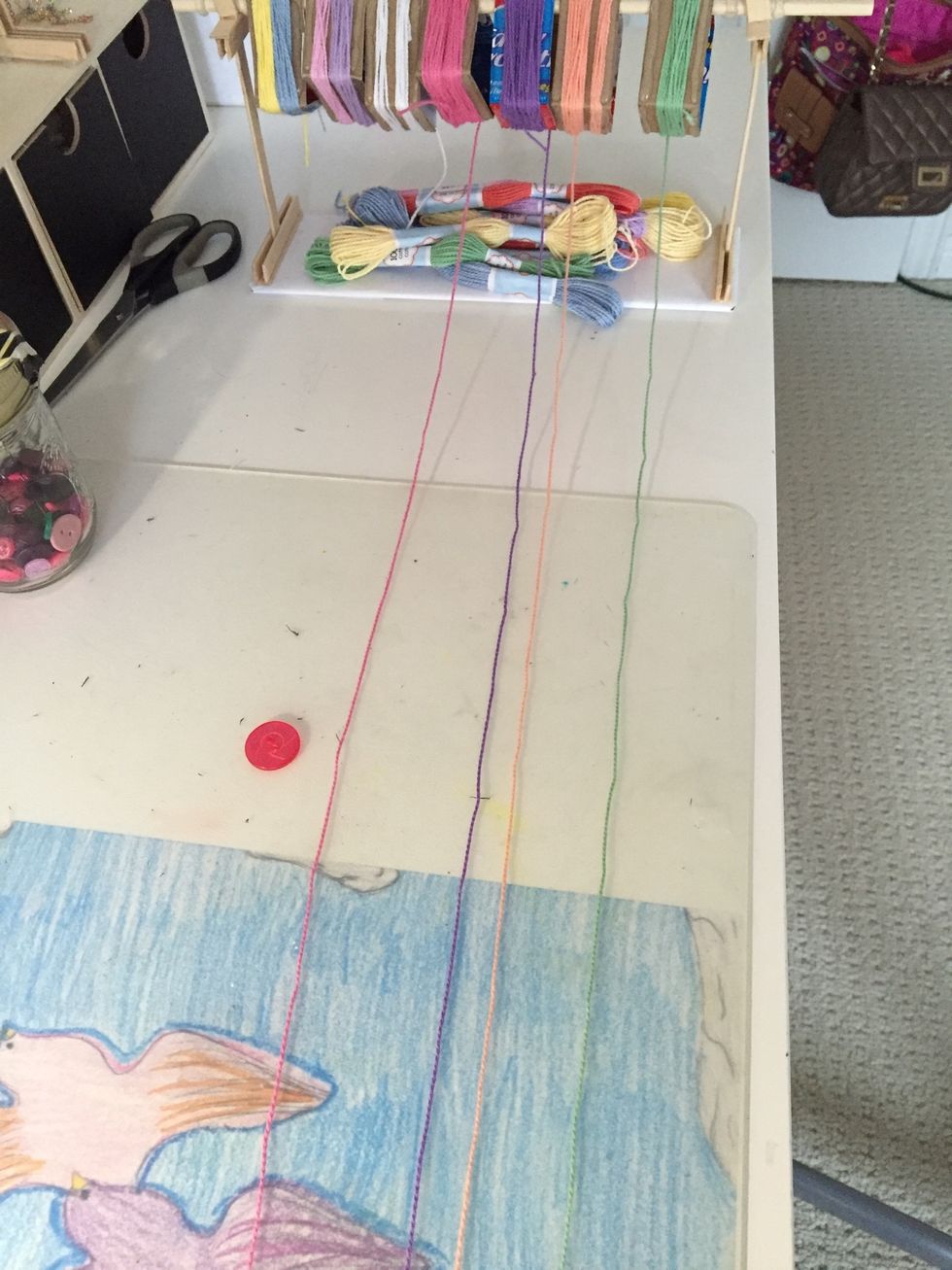 Now I measured about 1 meter of string for each colour and got a button that matched the colour of my string