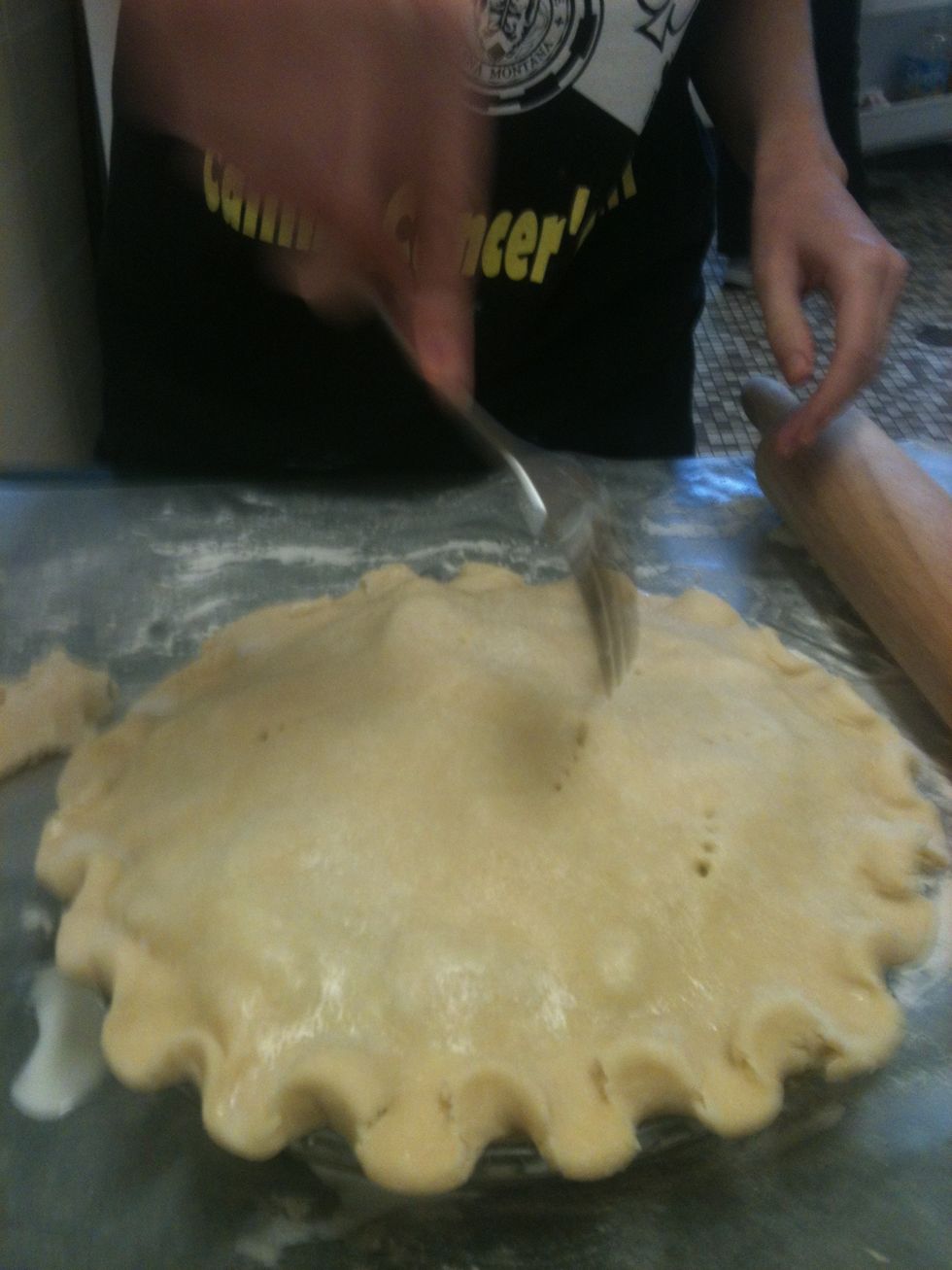 Now I poke hole in the top crust with a fork! You can create any design you want. It's fun :)
