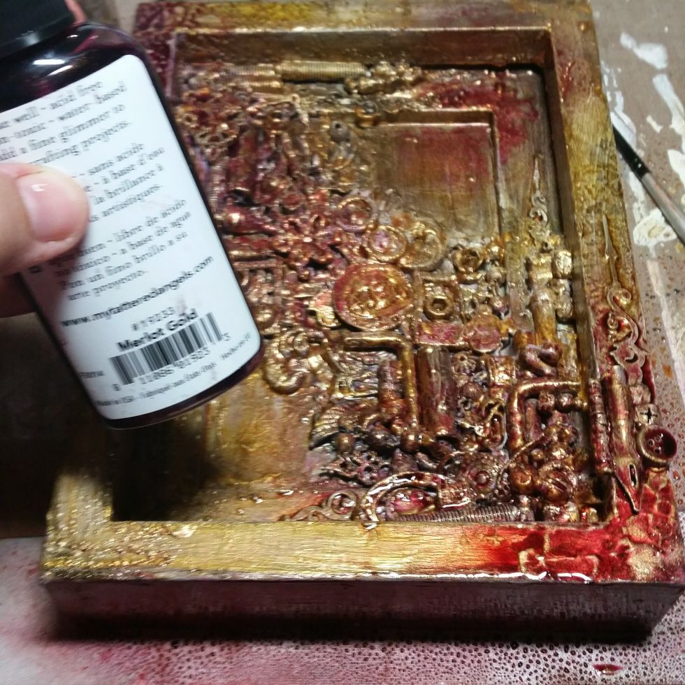 Now I started to layer mists of color in reds, bronze, yellows, golds, etc. Letting it dry and adding more where is needs more.