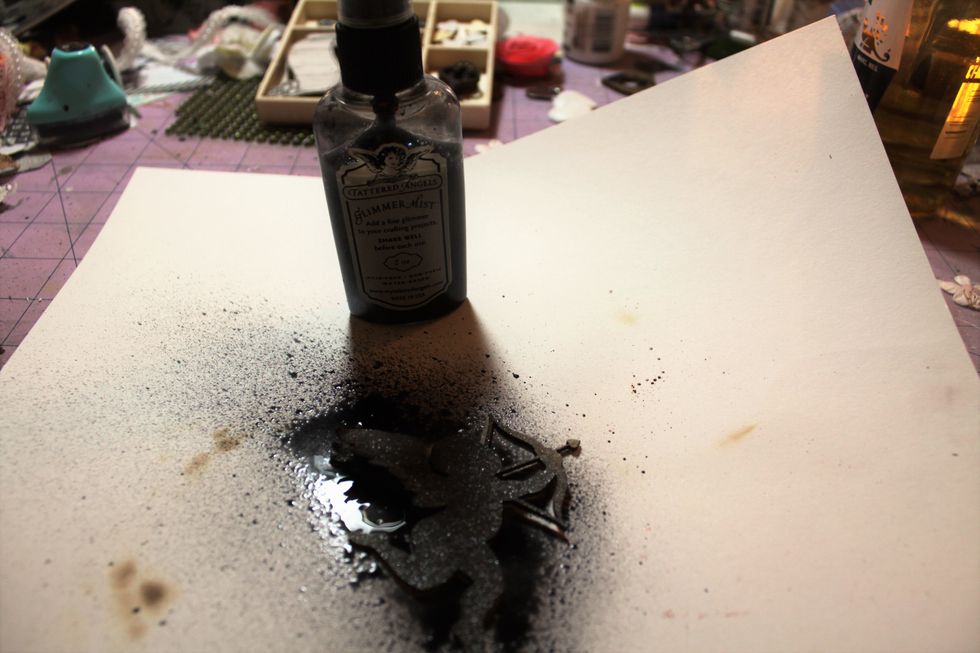 Now, I used Glimmer mist to cover her all in one color. I made sure to spray in between all the layers of her wings, too.