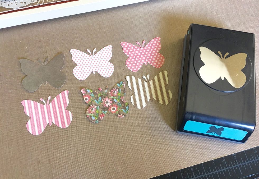 Now I want to create the dimensional butterflies for my sign. I want to make them look as if they are "fluttering". I'm using an EK success punch. Each butterfly will be 2 layers...