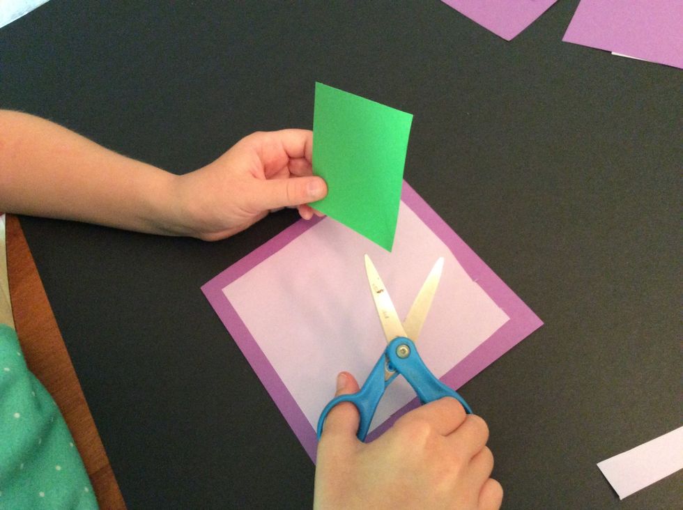 Now I will use my scissors to cut my small square into a circle shape.