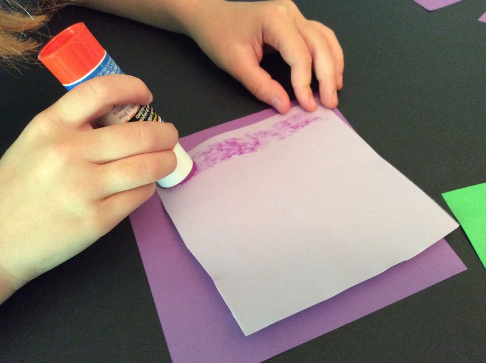 Now I will use the glue stick and put glue on my smaller square.