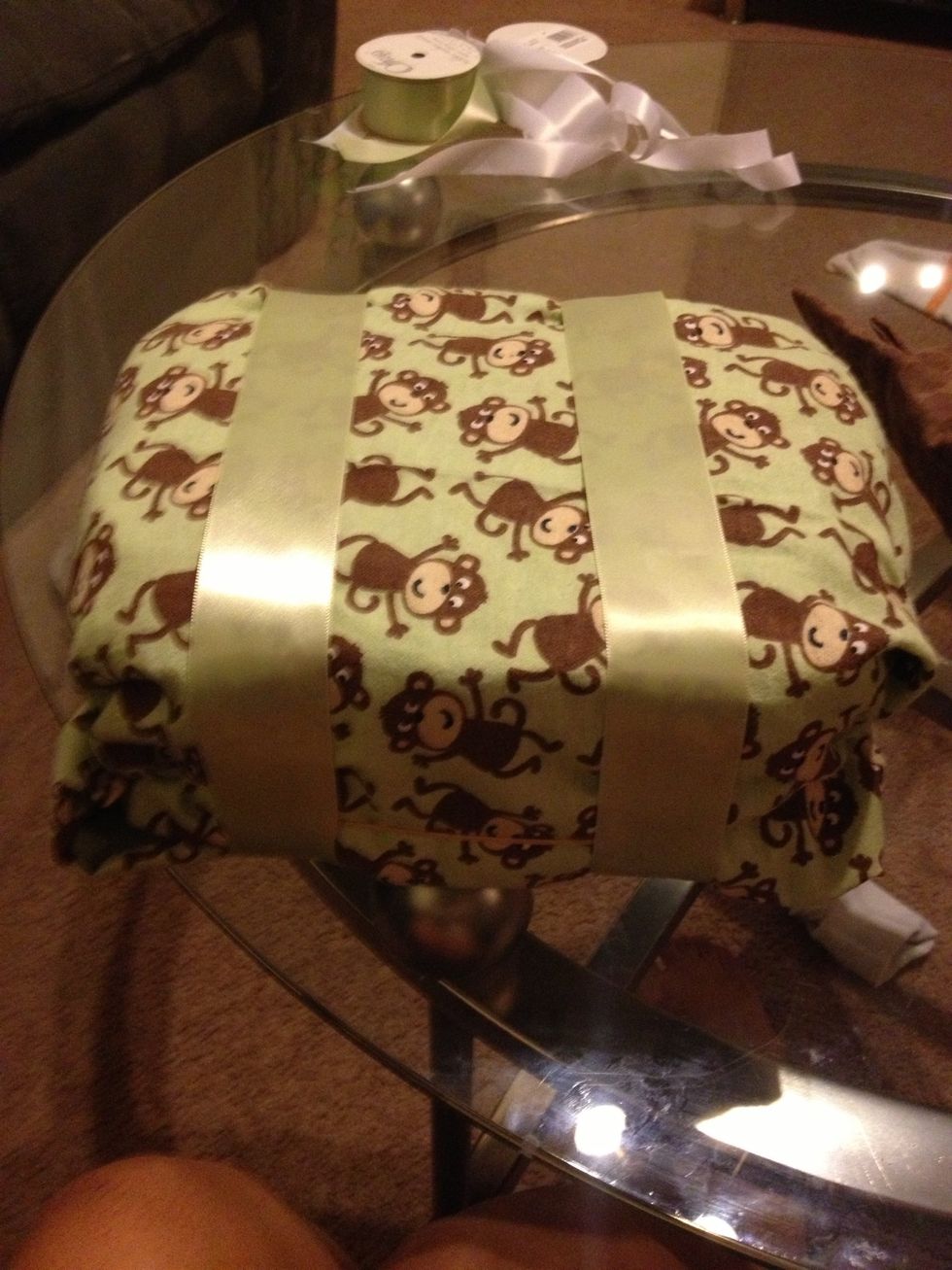 Now I wrapped two thick ribbons around to hold secure. Later you can use that ribbon to help secure the bed to the axels.