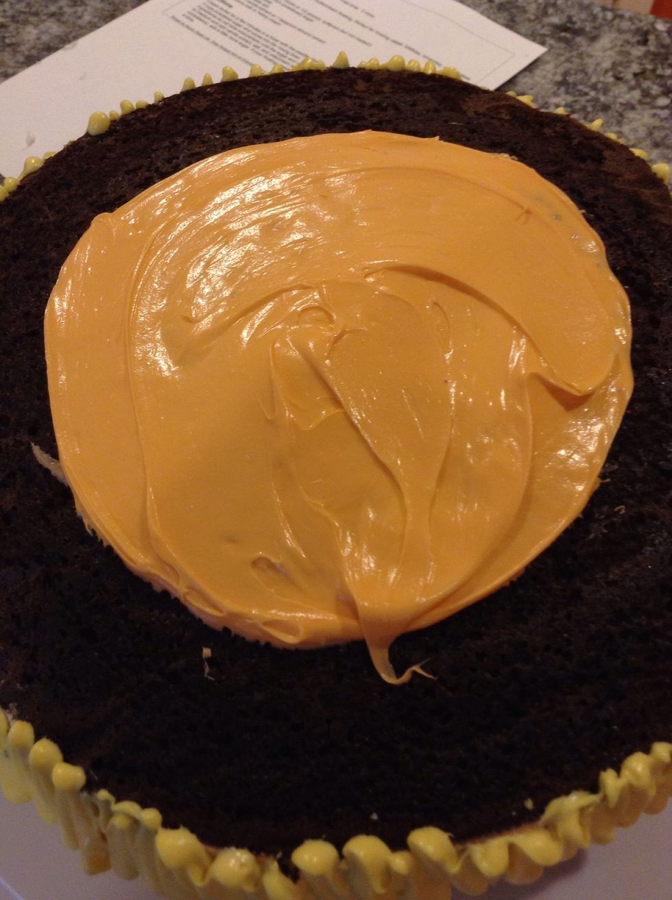 Now ice the top with your next color. After this I put it in the fridge for an hour because the frosting was really soft.
