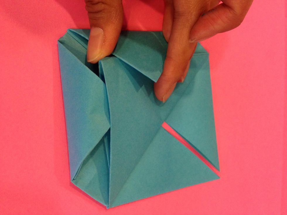 Now if you see the triangle there is a secret pocket that we created earlier just for the bottom to slip in and stay in place - go ahead and put the corner into the slip