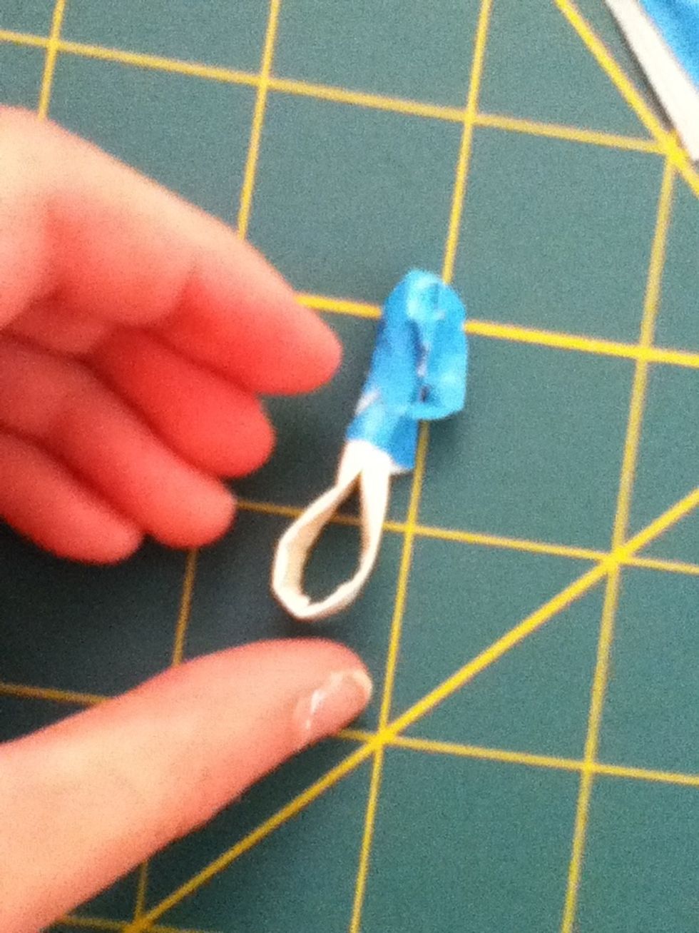 Now if you want to, put some blue tape on the top. Otherwise youll be able to see white in the middle of your flower. It doesnt matter if this parts messy.