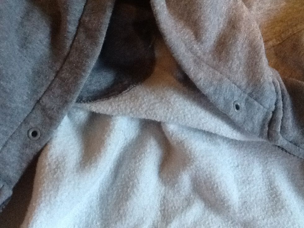 Now, if yours came with a string like mine you will have to remove the string AND the two plastic pieces. If not make another two cuts where you want the headphones to appear