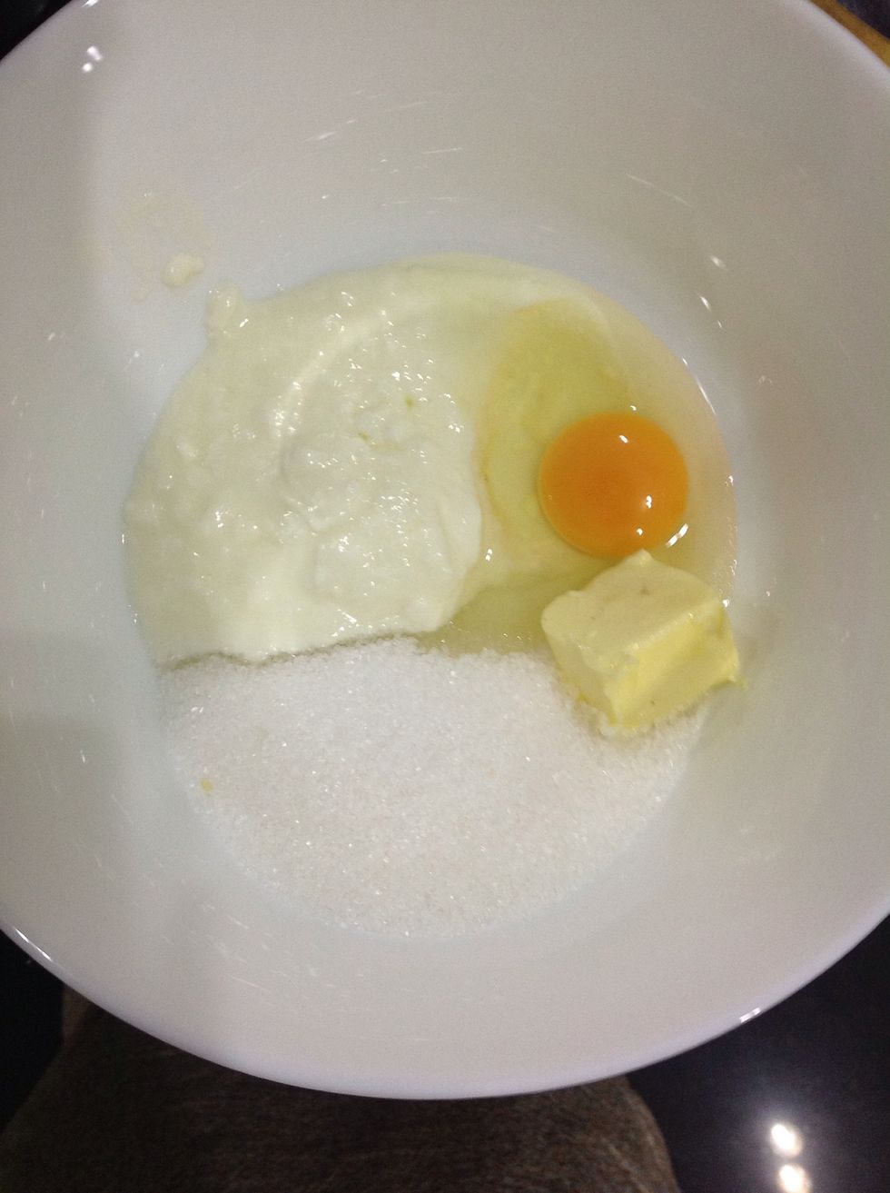 Now in a large bowl, mix the egg, butter, sour cream and sugar. Ideally, you should melt the butter but my butter was extreeeeemely soft and I was lazy to get another plate to melt butter and wash it.