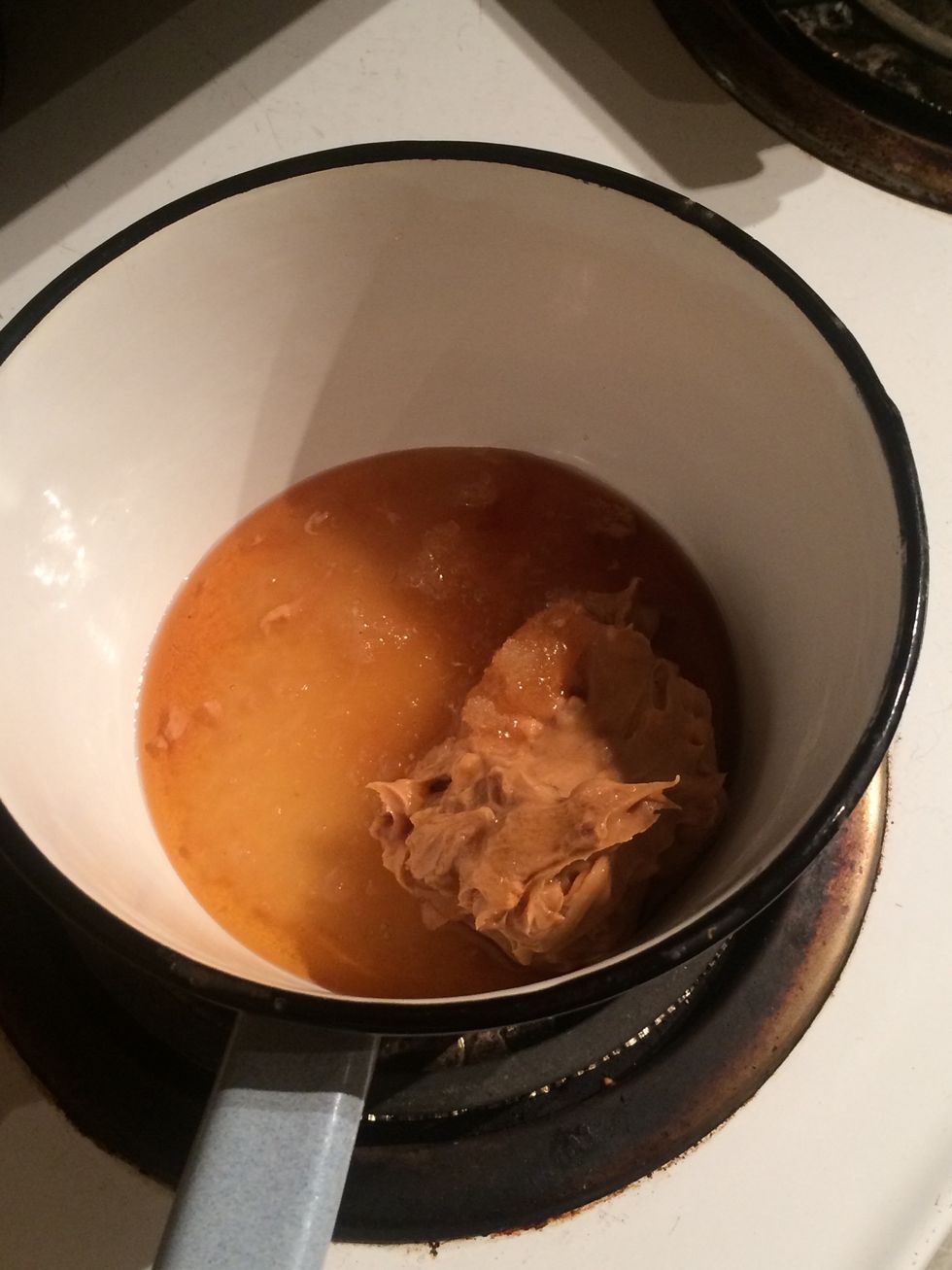 Now in a sauce pan, place the peanut butter, honey and maple syrup. Heat up on a low setting. We just want to heat it up not boil it.