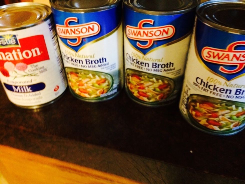 Now in another small pot.. Start heating up your liquid of choice. I prefer 3 cans of chicken stock with 1 can of evaporated milk. You can use beef broth, tomato, milk or water.