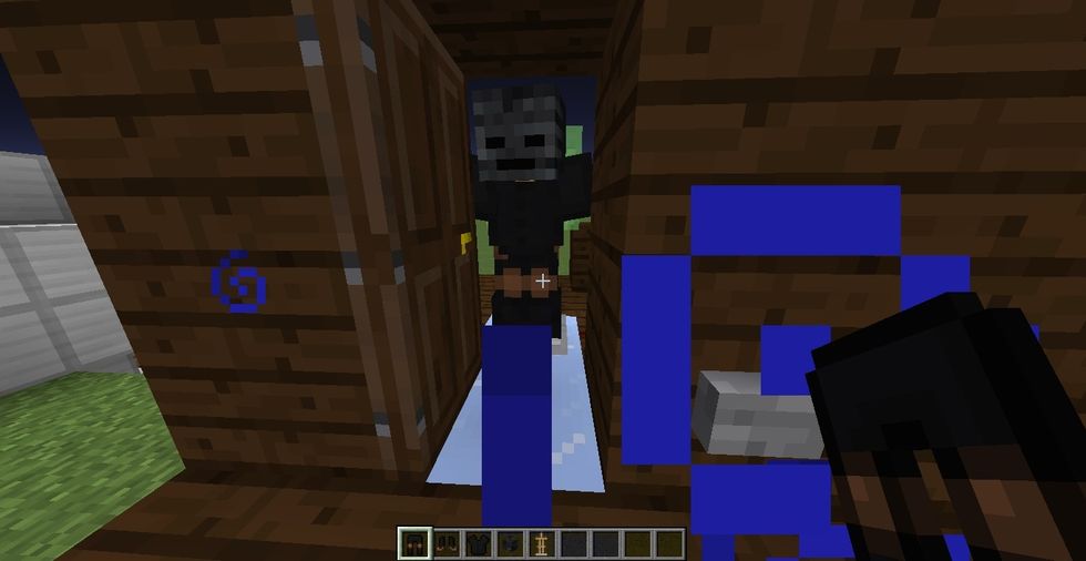 now, in front of slime block, place a armor stand and put skull and leather armor on it to make it look like some mob. (I apologize for that potion effect :(  it is night vision. nothing special...)