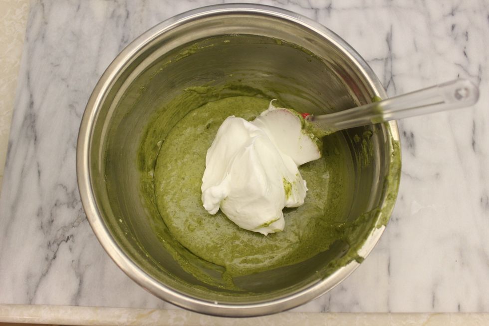 Now incorporate the meringue into the egg yolk mixture. Gently fold in 1/3 of the meringue. Avoid over folding so you don't deflate the batter.