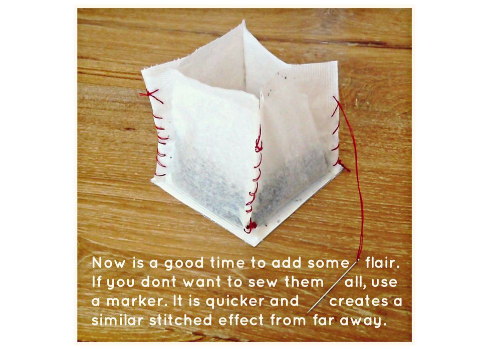 Now is a good time to add some flair... I used a loose whip stitch & a blanket stitch for my lanterns. You can also use a marker to create a similar effect if you do not want to sew all of the edges.