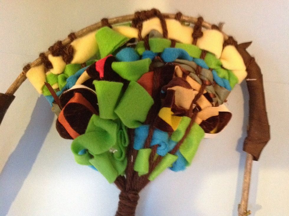 Now is a good time to take your loose ends of weft, and wind them around the back of your tree. Tuck them into a couple of warp strings on the back.