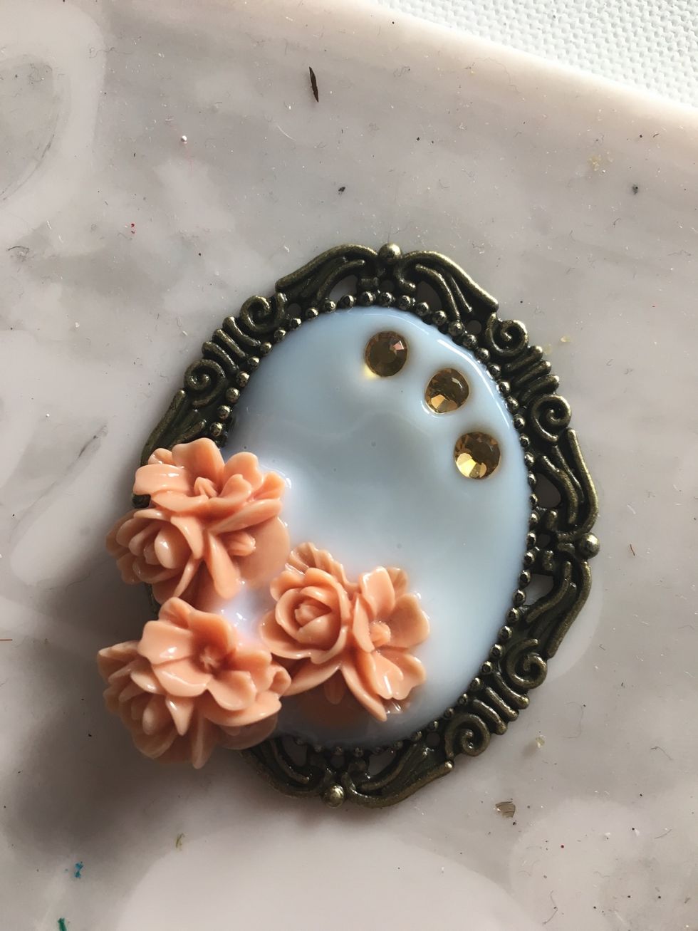 Now is the time to check your liquid glass for air bubbles. Using a needle pop and you see. You can also lift your project and lightly let it drop to promote any air bubbles to the top. Let it dry.