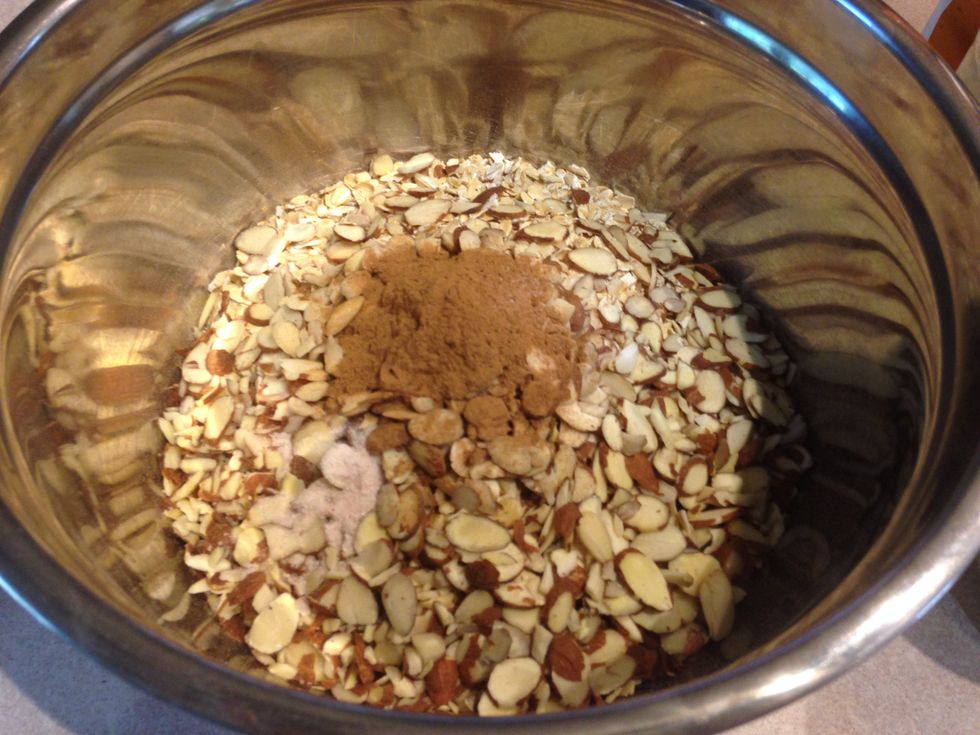 Now is the time to preheat your oven to 325 degrees. Add all the dry ingredients (except the dried fruit) to a large bowl and stir with a spatula.