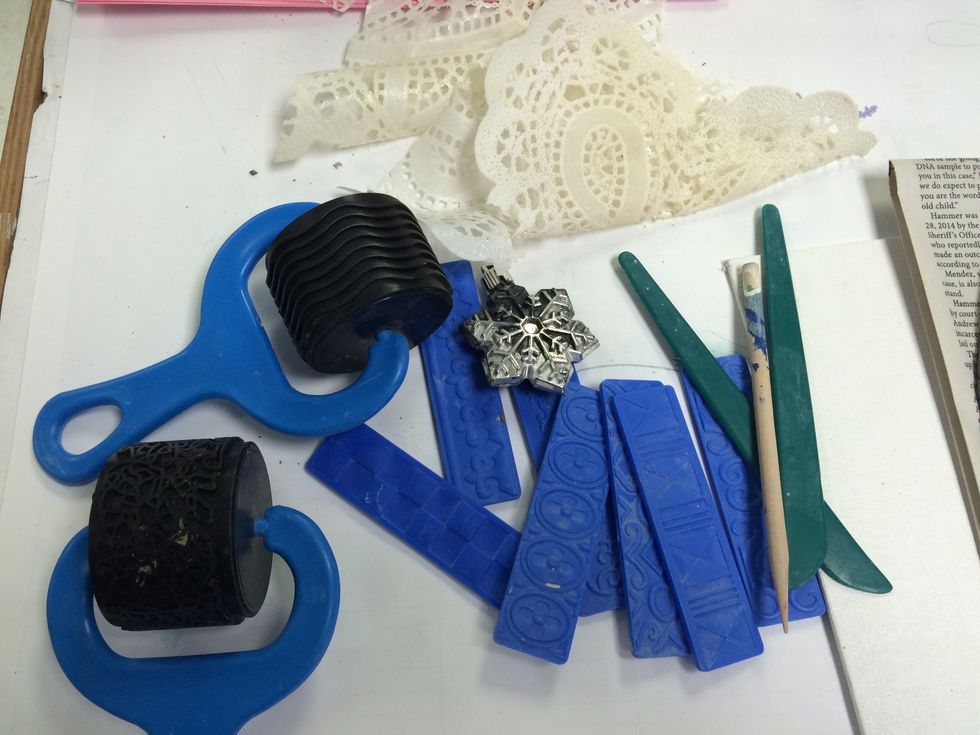 Now it is time to add TEXTURE to our SLAB. Collect things that can be pressed into clay to add texture.