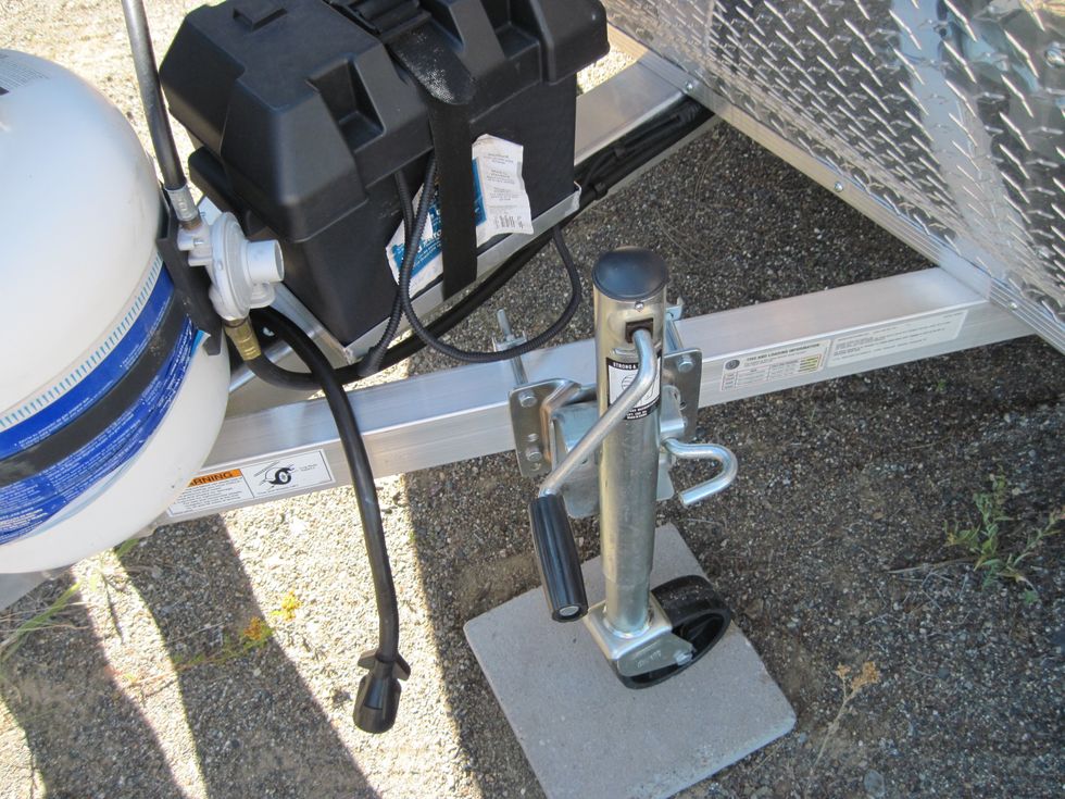 Now it is time to crank the trailer tongue up higher than the hitch ball. Turn the black handle to make the hitch go up about two inches higher than the ball on the tow vehicle.