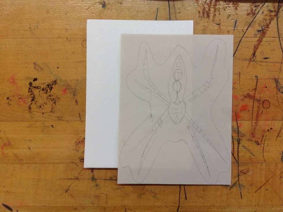 Now it is time to transfer your drawing onto the printing plate.  You will need to place your drawing over the styrofoam sheet.
