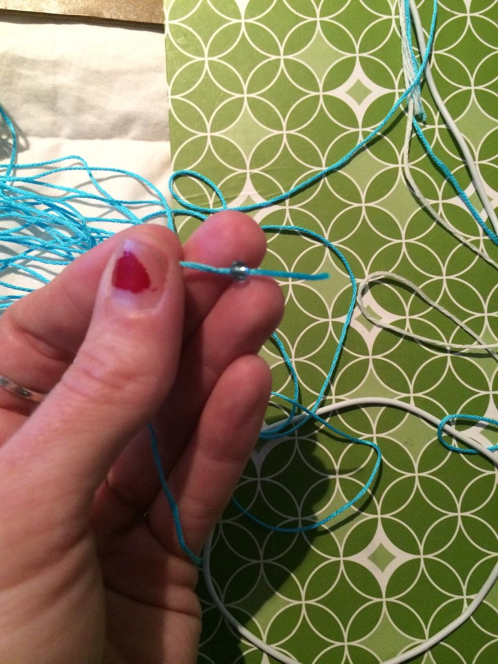 Now it's time to add a bead if you would like. I had to unwind my string from the bobbin to put the bead on but that's ok.