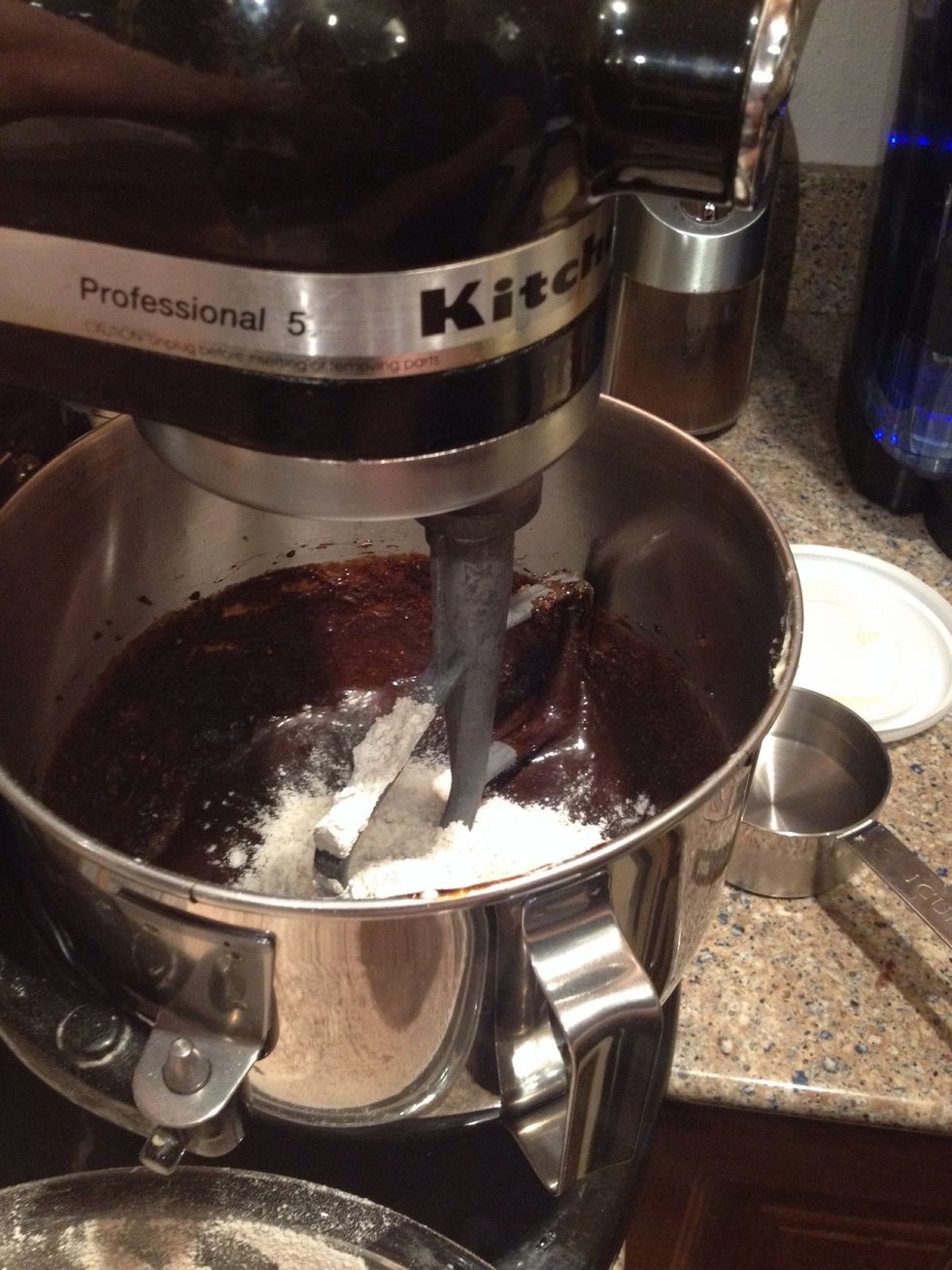 Now it's time to add the sifted flour, gradually, into the mixer bowl.